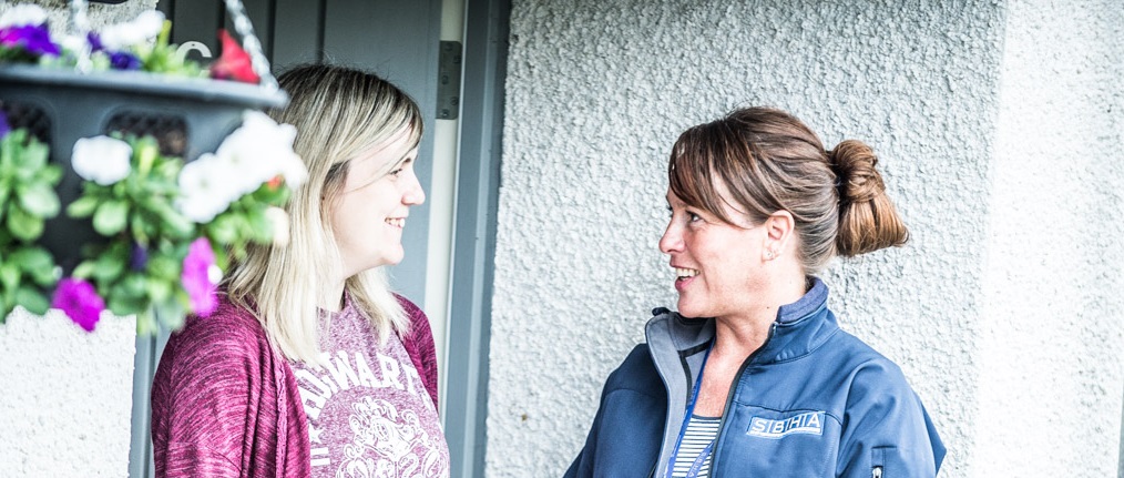 SBHA team with tenant